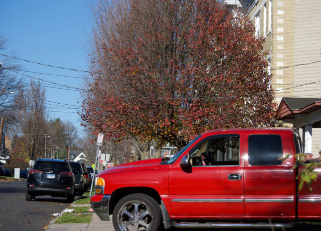 Photo of a pickup truck blocking sidewalk because driver didn't feel like pulling into driveway