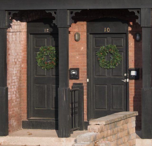 Two doors with wreaths