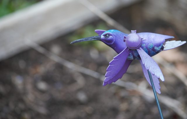 A purple hummingbird decoration