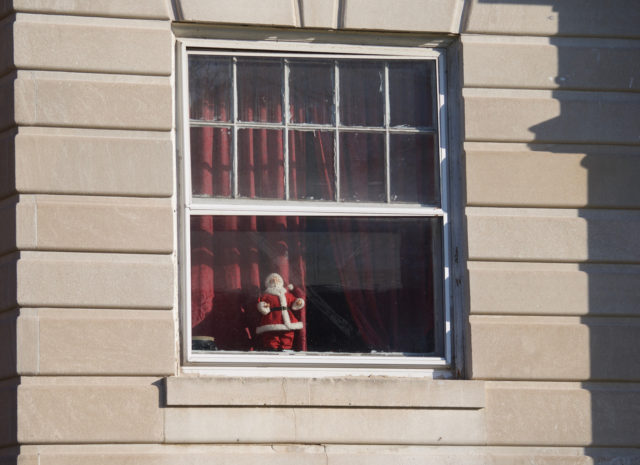 Santa figurine in apartment building window 