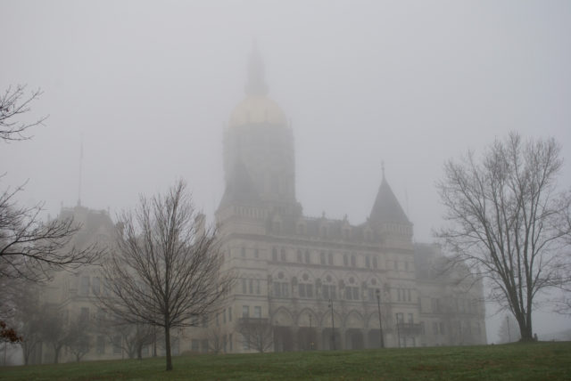 State Capitol building veiled by fog