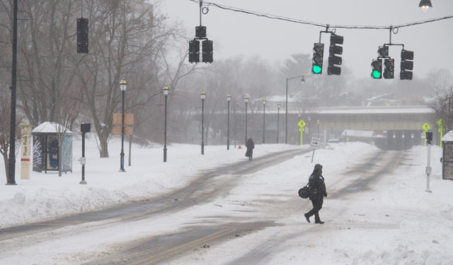 People walking to work in a blizzard