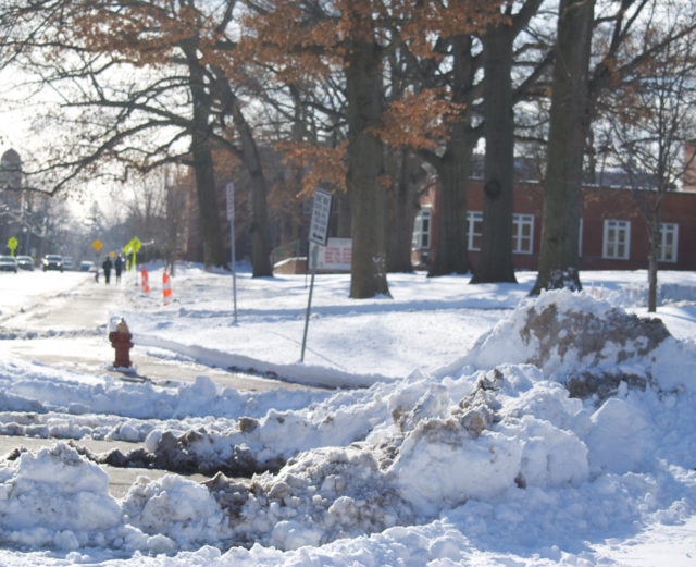 Snow plowed into the crosswalk