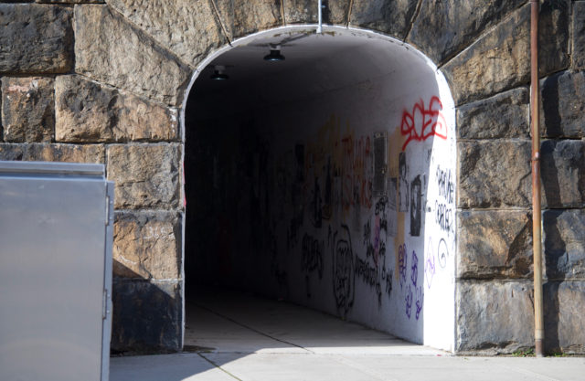 Pedestrian tunnel filled with graffiti 