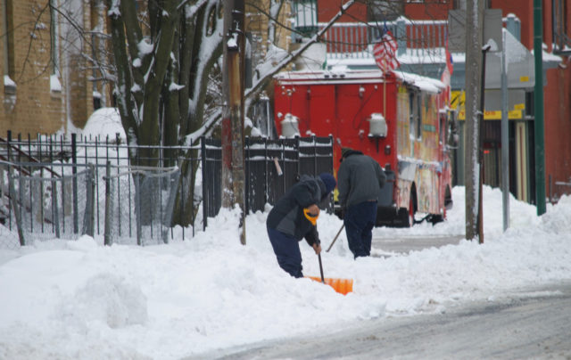 People shoveling snow