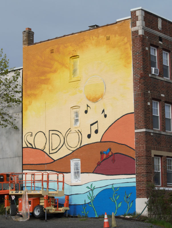 Mural with sun and coqui