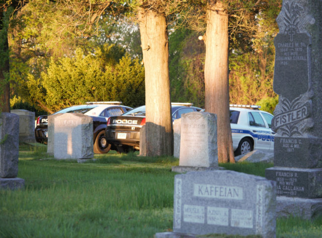 police cruisers in the cemetery