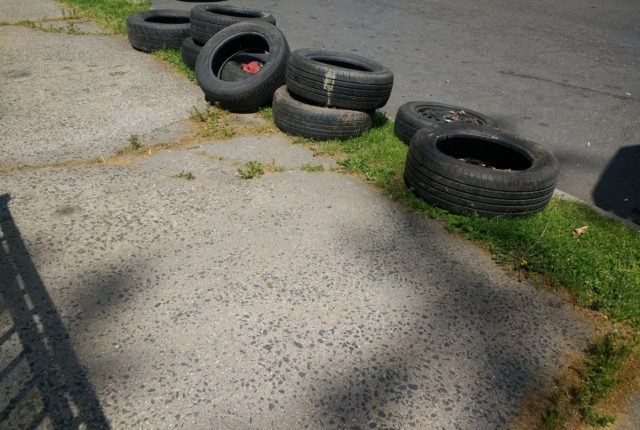 Tires on sidewalk