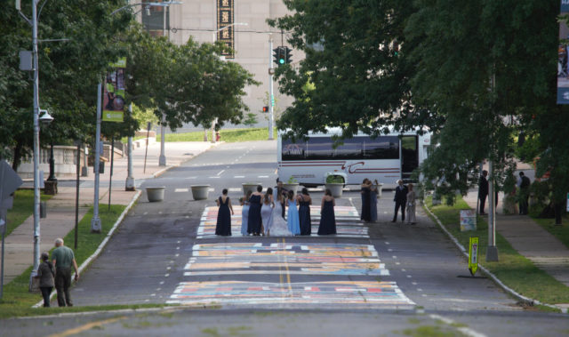 Wedding party standing on Black Lives Matter mural