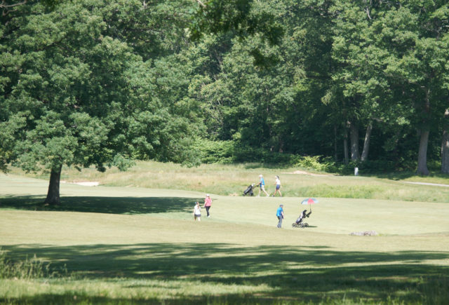 People golfing in Keney Park