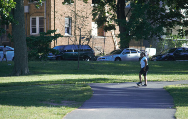 Young person on skateboard in park