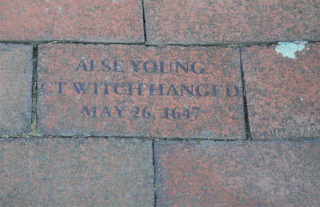 Brick reading Alse Young Witch Hanged